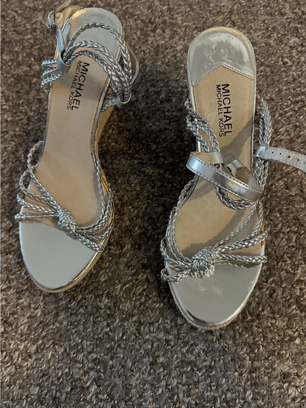 New, never worn Michael Kors Metallic Silver Braided Knot Sandals. Size 8.5.